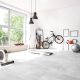 A spacious home gym with an exercise bike and treadmill