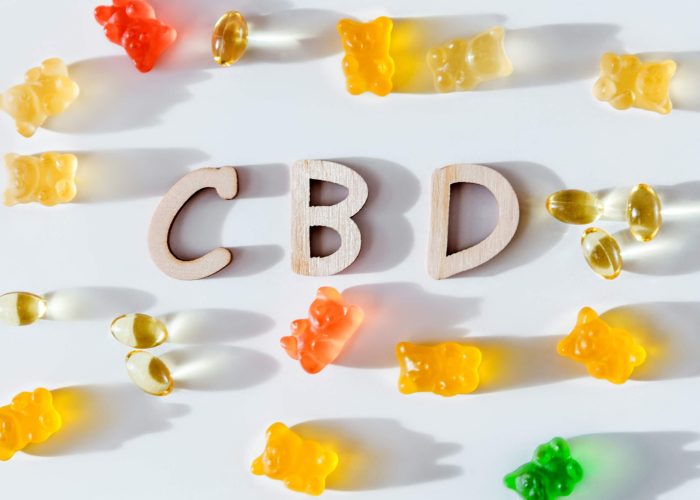 The letters CBD surrounded by CBD gummies