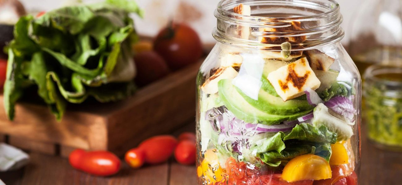 A glass jar filled with healthy foods