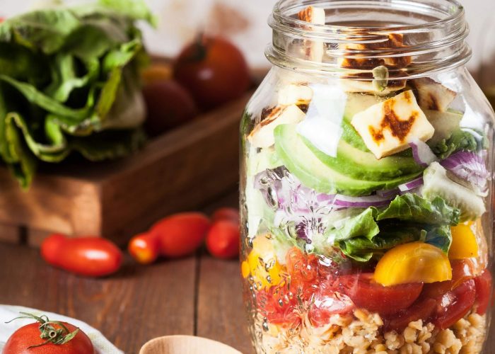 A glass jar filled with healthy foods