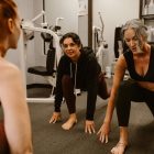 Two women exercising in a gym