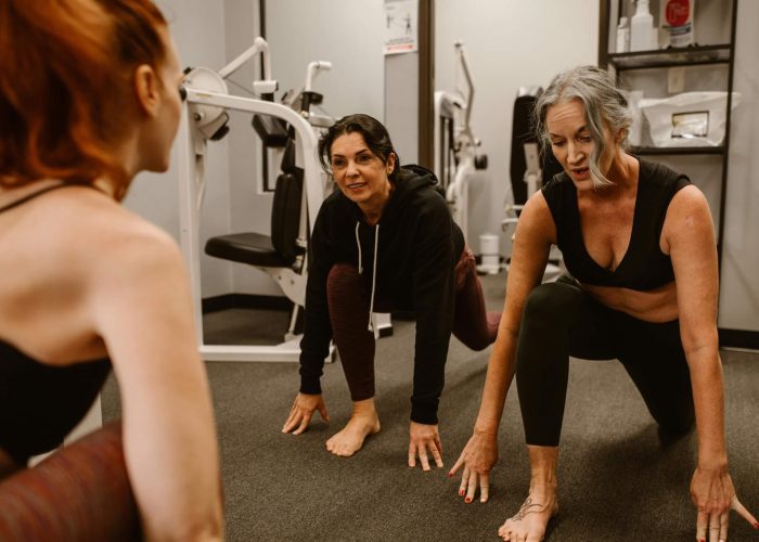 Two women exercising in a gym