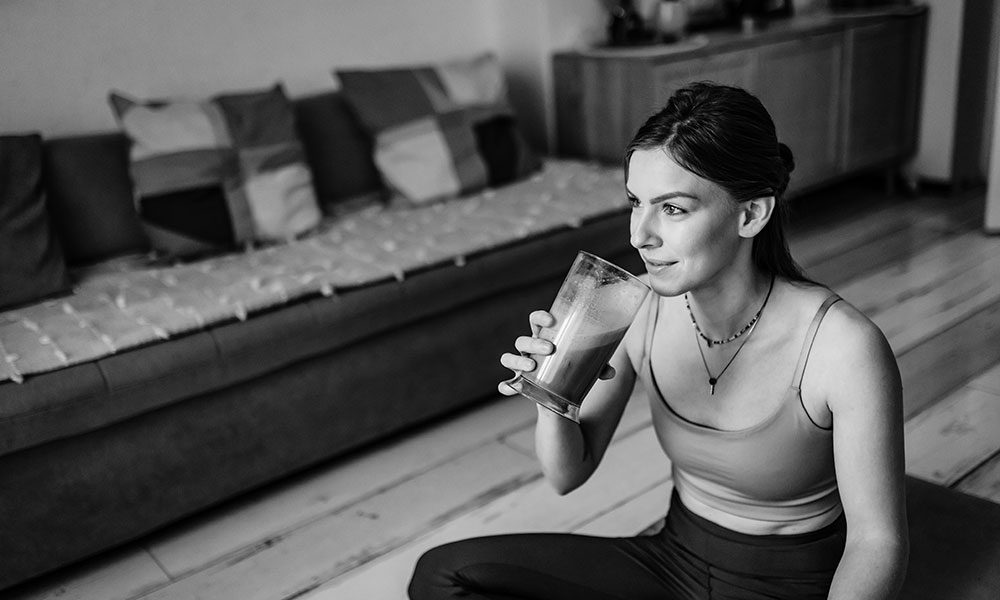 Woman drinking SuperNutrio milk