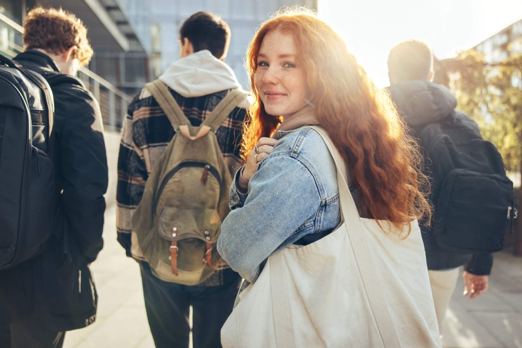 A female student looking over her shoulder