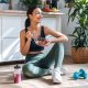 A form eating a healthy breakfast in fitness clothes